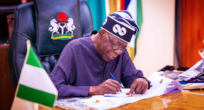 Tinubu signing Electoral Laws
