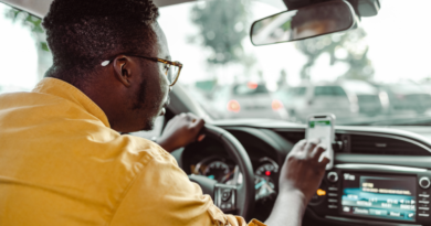 An Uber Driver in his car