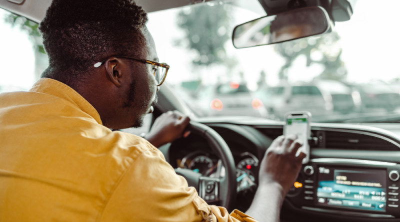 An Uber Driver in his car